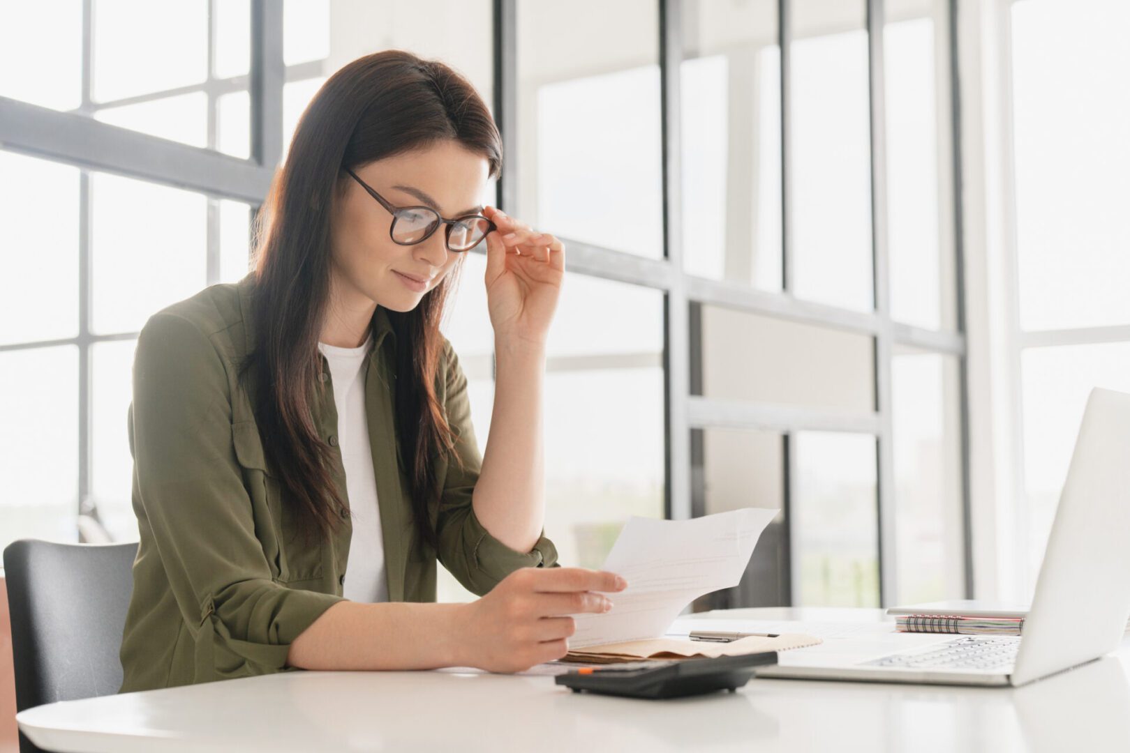 Professional woman reading paper