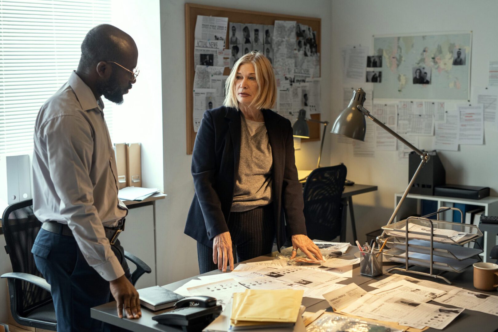 Colleagues reviewing paperwork in an office