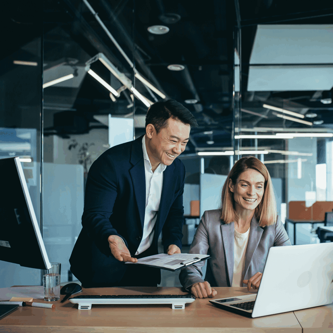 Colleagues collaborating at office desk