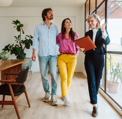 Happy couple viewing new home interior