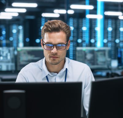 IT professional analyzing computer data