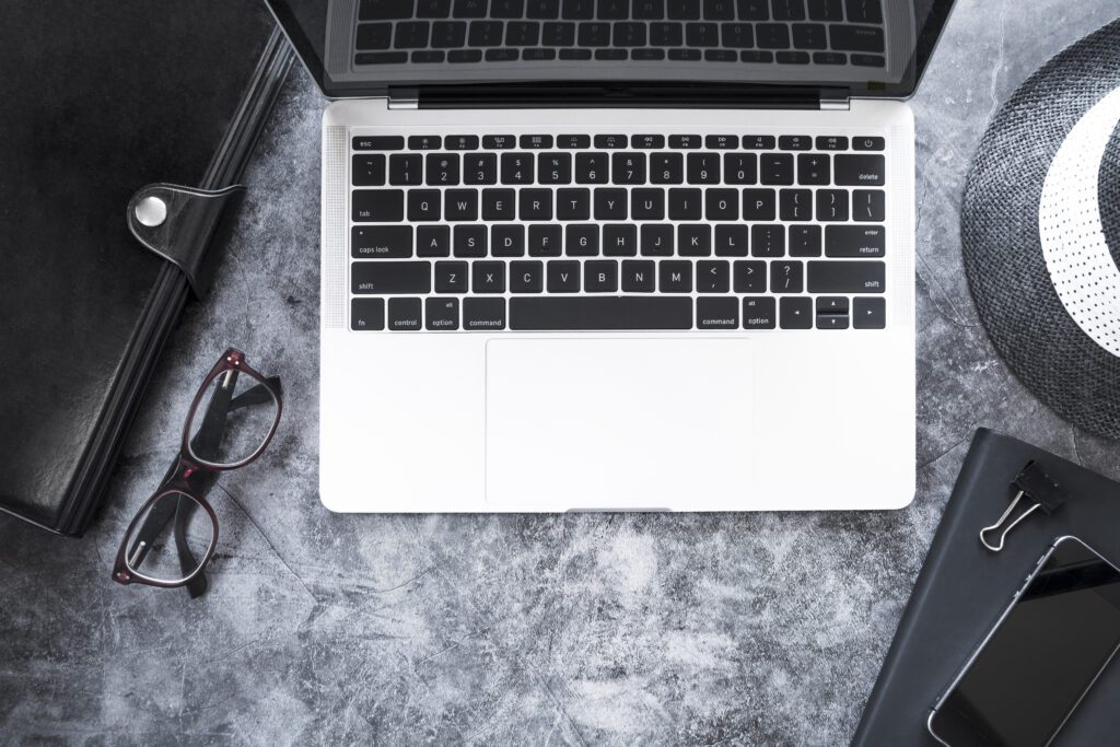 Top-down view of laptop with desk accessories